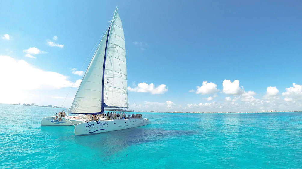 Catamaran sailing tour in Isla Mujeres with turquoise Caribbean water