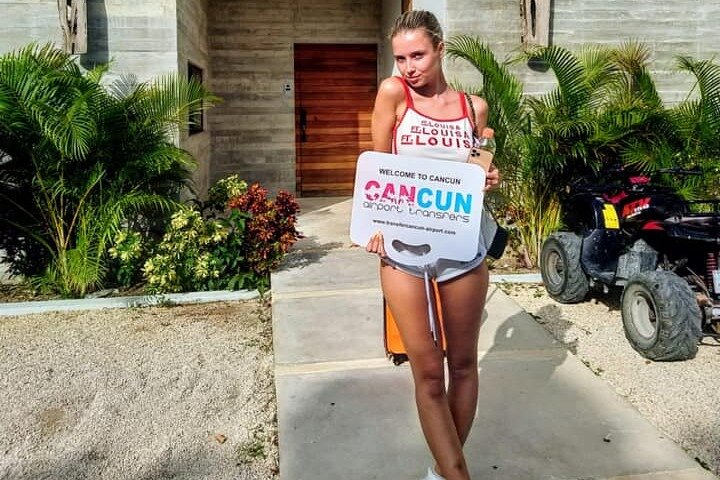 Cancun Airport Transportation representative greeting travelers